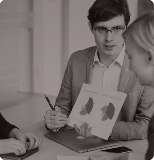 An agent reviewing a policy document with a client