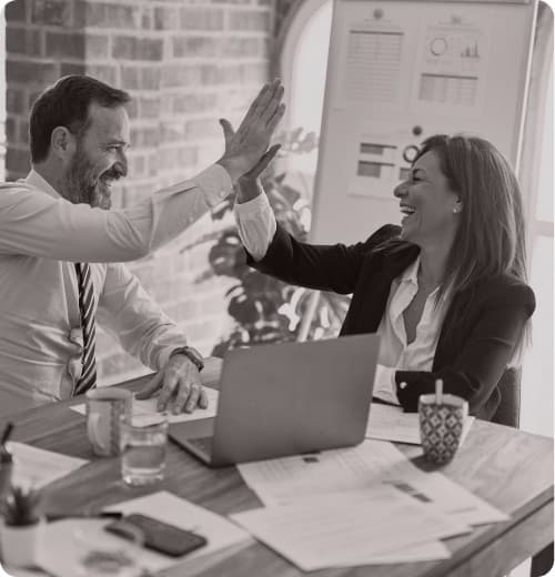 A homeowner signing paperwork with an agent