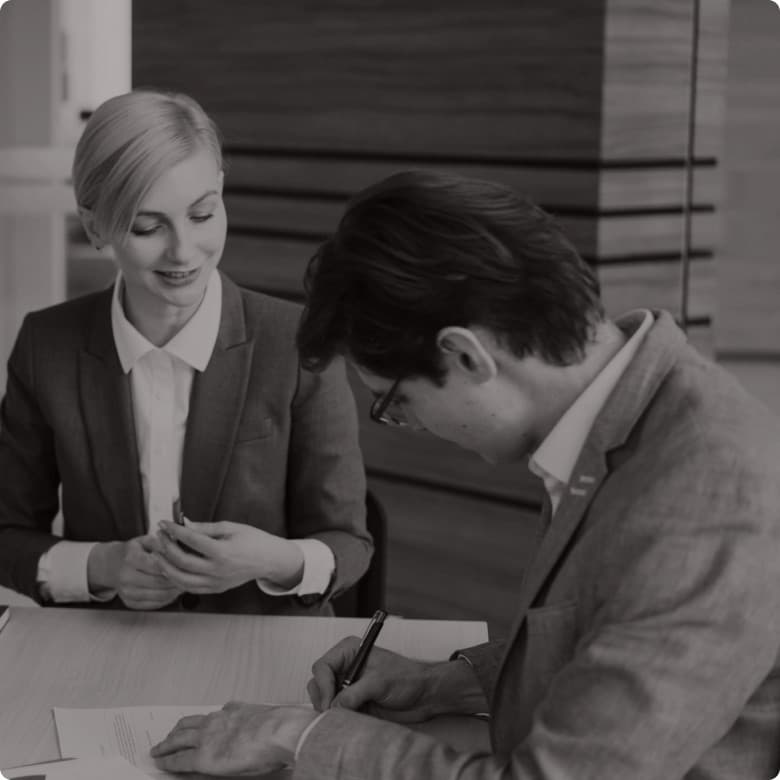 Two colleagues working through an account together